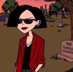 a woman in sunglasses and a red blazer standing next to a gravestone at sunset