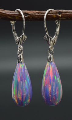 Our 14K Solid White Gold Tear Drop Purple Fire Opal Lever back Dangle Earrings are constructed of stable brass material 14K gold externals will survive for a long time to wear. It is suitable for birthdays, Valentine's Day, Christmas, Mother's Day, Anniversary, etc. Specifications: Metal 14k White Gold Style Opal Leverback Earrings Finish High Polished Earring Type Dangle (Drop) Gem Purple Opal Main Stone Shape Tear Drop Main Stone Creation Synthetic Fastening Leverback Stamp 14K Height 37 mm (1 Multicolor Dangle Earrings For Formal Occasions, Multicolor Teardrop Earrings For Formal Occasions, Purple Opal, Purple Fire, Leverback Earrings, Earring Type, Opal Earrings, Brass Material, Pretty Jewellery