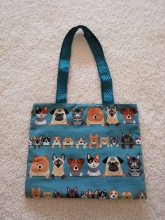 If you like doggies and cats, this bag is for you. Sewn in cotton fabrics, this bag will accompany you everywhere. Practical with its 3 inner pockets to store various accessories. This modern and colorful bag will follow you everywhere. Dimensions: width: 36cm - height: 29 cm Dimensions with handles: 58 cm Colorful Bags, Cotton Fabrics, Follow You, Purses And Handbags, Shoulder Bags, Cotton Fabric, Handles, Tote Bag, Shoulder Bag