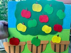 an apple tree made out of felt with apples on it