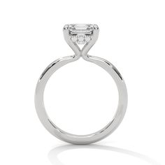 The Ivora Setting, a captivating solitaire ring that blends elegance with intricate detail. This setting features a hidden halo that subtly enhances the center stone’s brilliance, while the prongs flower open to cradle the diamond. Perfect for those who appreciate unique and delicate craftsmanship, The Ivora Setting is a stunning symbol of timeless beauty and refined sophistication. Luxury Asscher Cut Solitaire Wedding Ring, Moissanite Solitaire Halo Ring In Fine Jewelry Style, Luxury Radiant Cut Single Diamond Wedding Ring, Solitaire Asscher Cut Lab Grown Diamond Ring, Asscher Cut Solitaire Lab Grown Diamond Ring, Asscher Cut Solitaire Ring With Lab Grown Diamond, Luxury Asscher Cut Solitaire Diamond Ring, Timeless White Gold Solitaire Halo Ring, Fine Jewelry Asscher Cut Brilliant Halo Ring