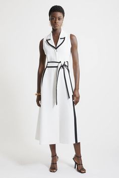 Feel Confident In Our Midi Dress, With A Shirt Style Design Featuring A Formal Collar, As Well As A Belted Waist For A Cinched Silhouette, And A Long, Flared Skirt. Style It With Block Heels Or Ankle Boots For A Look Perfect For Office Days, Then Wear It With Heeled Boots Or Strappy Heels For An Evening Look. Compact Stretch Contrast Tipped Belted Full Skirt Midaxi Dress Flattering Fit And Flare Silhouette Unique Contrasting Trim Details V Neckline Formal Collar Detailing Belted Waist Feature Re Collared White Midi Dress For Work, White Collared Midi Dress For Work, Elegant White Collared Dress, White Belted Midi Dress For Work, White Collared Midi Dress For Office, Chic White Collared Midi Dress, White Chic Dress With Contrast Trim, White Summer Midi Dress For Semi-formal Occasions, White Collared Semi-formal Dress