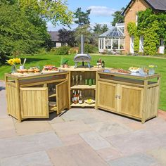 an outdoor kitchen with lots of food and drinks