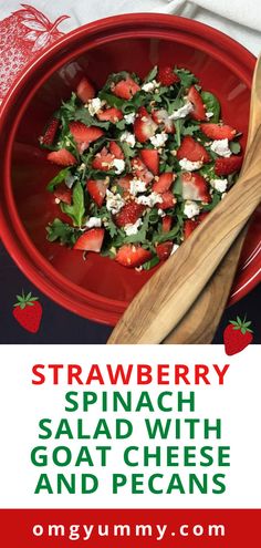 strawberry spinach salad with goat cheese and pecans in a red bowl on a table