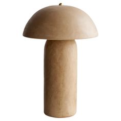 a mushroom shaped table lamp on a white background