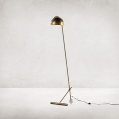 a floor lamp with a cord attached to it and a light bulb on the end