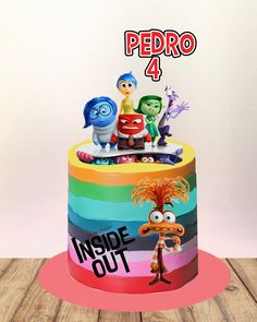 a colorful cake with cartoon characters on top and the words peppo 4 inside out