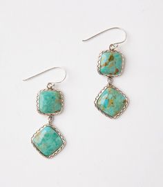 Handcrafted by artisans, these stunning earrings are detailed with turquoise stones encased in sterling-silver. Turquoise Stud Earrings, Turquoise Accents, Bride Earrings, Handcrafted Bracelets, Turquoise Stones, Genuine Turquoise, Stunning Earrings, Turquoise Earrings, Turquoise Gemstone