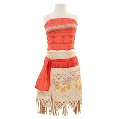 a mannequin is dressed up in an orange and white dress with tassels