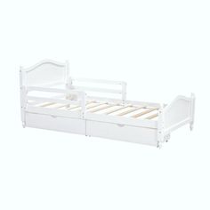 a white bed frame with two drawers on the bottom and one drawer under it,