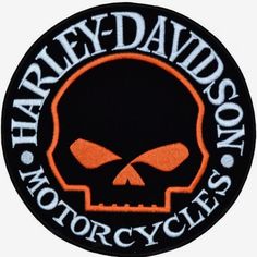 the harley davidson motorcycle logo is shown in black and orange with an orange skull on it