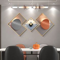 a dining room table with two chairs and a clock on the wall above it that reads 3 o'clock