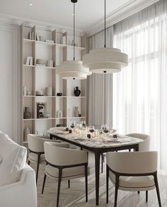 an elegant dining room with white chairs and table