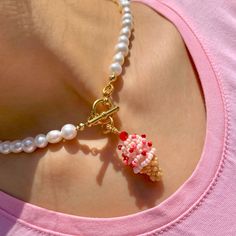 Strawberry on a Cone Details Length: 15-16in  Ice Cream Height: 1in tall Materials 14k Gold Plated Toggle Clasp Natural Freshwater Pearls Glass beads  Gemstones Beaded ice cream charm pearl necklace.  All ice cream charms are designed and handmade by us. Bringing some Y2K vibes into our Summer this year with bright colors and freshwater pearls. We hope our Ice Cream Collection can melt your hearts and sweeten up your summer:) More flavors are available on our shop so go check them out by clickin Beaded Ice Cream, Strawberry Beads Necklace, Cheap Beaded Kawaii Jewelry, Ice Cream Necklace, Cute Strawberry Necklace, Multicolor Beaded Kawaii Jewelry, Pink Handmade Fairy Kei Jewelry, Pinterest Jewelry, Strawberry Necklace