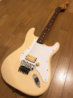 an electric guitar laying on the floor