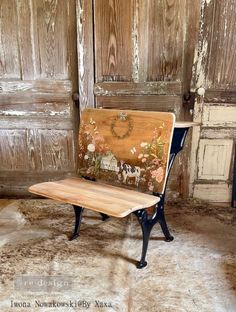 a wooden bench sitting on top of a rug next to an old door and wall