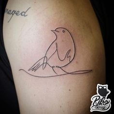 a tattoo with a bird sitting on top of it's arm and the word changed written in cursive writing