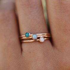 Dainty band with 3 different opal stone options. Looking for something a little bigger? Shop the 5mm stone here. Dainty Opal Ring Gift, Dainty Opal Ring With Birthstone In Round Band, Dainty Adjustable Opal Ring Gift, Elegant Adjustable Opal Stackable Rings, Minimalist Opal Birthstone Jewelry, Dainty Adjustable Opal Gemstone Ring, Opal Stackable Rings With Birthstone For Promise, Adjustable Opal Birthstone Jewelry, Adjustable Opal Birthstone Ring For Everyday