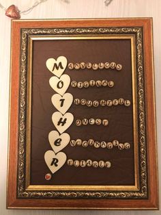 a framed sign that says mother with hearts on it