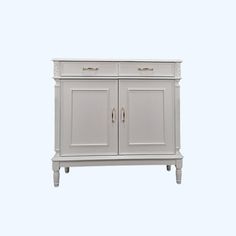 a white cabinet with two doors and drawers