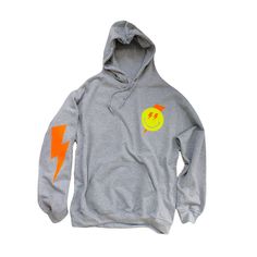 Smiley Face Lightning Bolt Hoodie Women's Trendy Sweatshirt Smiley Face Oversized Hoodie Sweatshirt Neon Smiley Face Hoodies 📦 FREE SHIPPING on orders $35 or more to US shoppers 🛒Our unisex Smiley Face Lightning Bolt Hoodies are a soft relaxed/loose fitting sweatshirt, perfect for lounging around the house, relaxing, or running errands. 👕Brand = Gildan 🧵Fabric = 50% Cotton / 50% Polyester ✂️Design = Heat-applied neon yellow and neon orange vinyl 🎨Color = Sports Grey (Colors will vary from c Cheap Graphic Print Sports Sweatshirt, Cheap Trendy Yellow Sweatshirt, Cheap Yellow Sweatshirt, Cheap Pink T-shirt For College, Cheap Pink Sports Hoodie, Cheap Pink Cotton Sweatpants, Cheap Women's Sweatpants For Sports, Cheap Relaxed Fit Cotton Sweatpants, Trendy Cheap Sweatpants For Sports