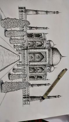 a pencil drawing of a building on paper with a pen in front of it and the image of a tower bridge