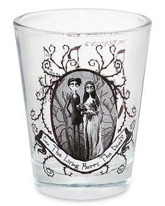 a shot glass with an image of the bride and groom