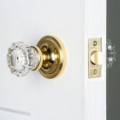 an open door with a glass knob on it