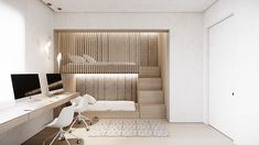 a room with a bed, desk and computer on the wall next to a white chair