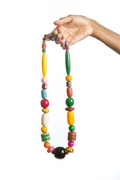 "Stunning unique, hand painted chunky wood bead necklace.  The necklace is designed using hand painted beads, sourced from Barcelona Spain.  Featuring colorful beads and an art deco design, this necklace is the perfect gift for the favorite woman on your gift list.   *Ready to ship *Bold and beautiful *Length: 15\" Image colors may appear brighter/darker on your computer monitor depending on resolution. **Please read our shipping and other shop policies before placing an order.  **Special offer: Artisan Multicolor Wooden Beaded Necklaces, Artisan Multicolor Wooden Beads Necklace, Unique Multicolor Wooden Beads Necklaces, Unique Multicolor Wooden Beads, Multicolor Wooden Beads, Multicolor Hand Painted Beaded Bohemian Necklace, Multicolor Hand Painted Bohemian Beaded Necklace, Bohemian Multicolor Hand Painted Beaded Necklaces, Colorful Wooden Beaded Necklaces