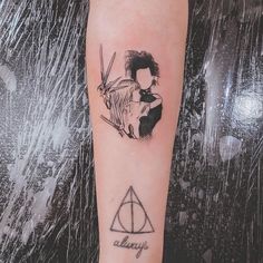 a harry potter tattoo on the left forearm and right arm with an image of two people