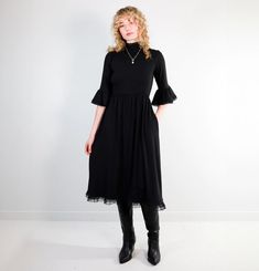 "Made from a luxurious blend of bamboo, cotton and a little elastane for good measure. This fabric is breathable, moisture-wicking, and machine washable, with an incredible drape. We don't mind if you spill the tea in our new Kiki Dress (it's machine washable). This tea length dress features a high lace mock-neck, and ¾ length lace-trimmed sleeves that flutter softly across the forearm. The full, gathered skirt panels are trimmed in our double-stacked lace for dramatic flare. Made from our signa Stretch Midi Dress With Lace Trim, Midi Dress With Lace Trim And Stretch Fit, Fall Stretch Dress With Lace Trim, Modest Midi Dress With Lace Trim, Daywear Midi Dress With Lace Trim, Lace Trim Midi Dress For Daywear, Flowy Lace Trim Dress For Fall, Fitted Lace Trim Midi Dress For Fall, Knee-length Maxi Dress With Lace Trim For Daywear