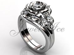 a white gold rose ring with diamonds on it