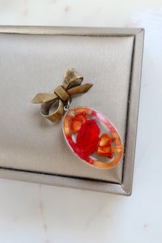 Vintage Resin Red Rose Bow Brooch. Length: 1 3/4" Width: 7/8" Vintage condition! please zoom in. Back to the shop: https://www.etsy.com/shop/SusVintage?ref=hdr_shop_menu If you have any questions feel free to contact me. Thank you!! Handmade Vintage Red Brooches, Vintage Red Pins For Gifts, Vintage Red Pins For Gift, Vintage Red Pins As Gift, Red Flower Brooches For Gift, Red Brooch For Anniversary On Valentine's Day, Red Brooches For Anniversary And Valentine's Day, Red Brooches For Valentine's Day, Handmade Red Brooches As Gift