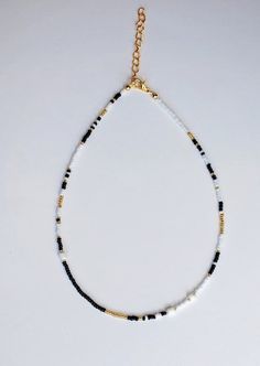 The London necklace has select sizes available with an adjustable 2-inch extender chain to comfortably fit any size neck. It is made of czech gold beads with white and black glass seed beads. Perfect for layering with other necklaces or chokers and great to wear with any outfit. It is made for any look you want; a cute choker or a collarbone necklace. It is carefully crafted to ensure durability so you can wear it everyday! London Necklace, Seed Bead Necklaces, Black And White Necklace, Collarbone Necklace, Fall Necklace, Black And White Necklaces, Autumn Necklace, Bead Necklaces, Layer Necklace