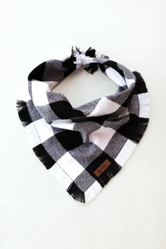 a black and white checkered scarf with tassels