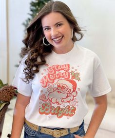 Get in the Christmas spirit with this adorable Stay Merry Retro Santa Graphic Tee Shirt. Offered on short sleeve tee, long sleeve tee, and even a sweatshirt for those cool winter days! Pair with jeans or leggins for the cutest Christmas outfit! These are unisex fit and are true to size. Short Sleeve - 6.0 oz. pre-shrunk 100% cotton Long Sleeve - 6.0 oz. pre-shrunk 100% cotton Sweatshirt - 8 oz pre-shrunk 50% cotton/50% polyester Christmas Graphic Tees, Santa Graphic, Cute Christmas Outfits, Christmas Tree Graphic, Cool Winter, Retro Santa, Monogram Shirts, Black Friday Christmas, Christmas Graphic