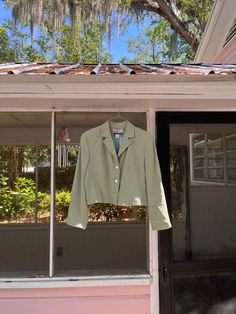 Gorgeous soft green cropped blazer. Fully lined. One shoulder has a mark - see video, priced accordingly. Fits best: S-L, depending on fit preference Fabric: 100% silk Shoulder pads: Yes *Due to the nature of vintage, subtle flaws are to be expected. Certain items may show signs of wear or age. Any noticeable marks/discolorations will be noted and priced accordingly. If you would like additional information/pictures, please don't hesitate to message us. All vintage items are final sale. Contact Elegant Cropped Spring Blazer, Green Fitted Casual Blazer, Spring Formal Cropped Outerwear, Trendy Fitted Green Cropped Jacket, Trendy Cropped Jacket With Notch Lapel For Spring, Green Long Sleeve Blazer For Spring, Green Long Sleeve Cropped Jacket For Spring, Spring Suit Collar Cropped Jacket For Work, Spring Cropped Suit Collar Jacket For Workwear