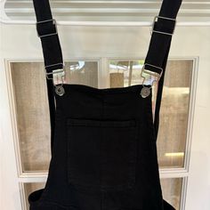 Never Worn. Black Overalls With Suspenders, Chic Black Overalls For Spring, Black Overall Jumpsuits And Rompers With Pockets, Black Summer Overalls For Workwear, Spring Black Overalls With Pockets, Black Spring Overalls With Pockets, Black Cotton Overalls With Suspenders, Black Summer Workwear Overalls, Black Denim Overalls For Spring