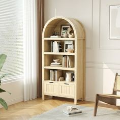 a living room with a chair and book shelf