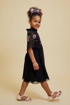 Oversized floral embroidery, realised in shimmering new season shades pop against the black backdrop of the darling Addie. Cut in a classic relaxed silhouette, this dress is complete with flared sleeves and a zip closure at back. Frock And Frill, Black Backdrop, Black Backdrops, Floral Embroidered Dress, Embroidered Dress, Flared Sleeves, New Season, Floral Embroidery, Black Floral