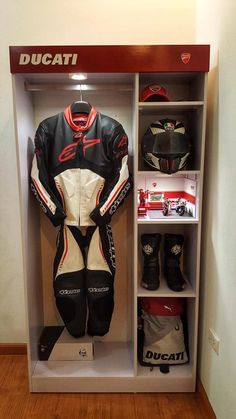 a display case filled with different types of motorcycle gear