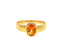 This beautiful ring is crafted from 14k yellow gold, and is adorned with a sparkling oval Citrine measuring 7mm x 5mm for a total weight of one carat, atop a ribbed shank. Both shoulders of the ring feature a ribbed design for an extra touch of sophistication. The face of the ring measures 8.8 mm with a rise of 5.7 mm off the finger's surfaceThe ring is a size 7.   Citrine is the birthstone for November babies and this ring makes a fantastic gift! Metal: 14k Yellow Gold Gemstone - Citrine Gemstone Size - 7 x 5 mm Cut: Oval Total weight: 1 carat Finger size  - 7 Classic Yellow Gold Sapphire Ring Oval Cabochon, Gold Oval Topaz Ring Stamped 14k, 14k Yellow Gold Oval Cabochon Birthstone Ring, Oval Yellow Gold Signet Ring With Gemstone, Oval Gold Topaz Ring With Polished Finish, Oval Gold Sapphire Ring, Oval Diamond Cut Signet Ring For Formal Occasions, Yellow Gold Solitaire Ring With Oval Cabochon, Yellow Gold Solitaire Rings In Oval Cabochon Shape