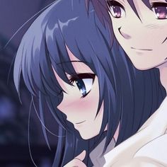 two anime characters are hugging each other in front of a dark room with blue lights