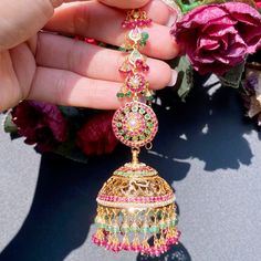 Featuring a pair of stunning bridal jadau jhumkas in 22ct gold. It has been embellished with precious rubies, emeralds and pearls. Magnificently designed, these earrings will make a lasting impression and are sure to become your most treasured heirlooms. It has an ear chain for support and to add that extra touch of royalty The earrings weigh 48.8 GMs including 9.05 GMs of hanging ruby emerald beads. Price Breakup Summary Component Rupees % of Total 22k Gold 218,075 81.2% Stones & Beads 3,265 1. 22k Gold Jhumkas For Weddings And Festivals, Bollywood Style 22k Gold Jhumkas For Wedding, 22k Gold Jhumkas For Wedding And Diwali, 22k Gold Meenakari Jhumkas For Wedding, 22k Gold Tilla Jhumkas For Wedding, 22k Gold Chandbali Jhumkas With Cutdana, 22k Gold Chandbali Jhumkas With Tilla, 22k Gold Chandbali Jhumkas For Festive Occasions, 22k Gold Meenakari Chandbali Jhumkas