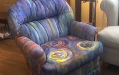 a chair that has been painted with different colors