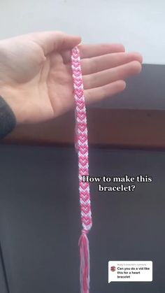 a hand holding a pink and white braided cord with the words how to make this bracelet?