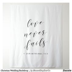 a white banner with the words love never falls on it