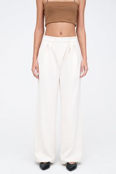 Handcrafted to last, designed for you to love—our Morrison Pants are your next signature cut. She’s fashioned from breathable European polyviscose and tailored to flatter with a wide-leg, high-waist silhouette. Featuring an angled button and hook closure that blends seamlessly into her pleats for unique visual movement, her style is ultra-wearable so you can drift easily from day to night.[SPLIT] Sam, in black, is 5'8" (173 cm) tall, wearing size XS. Astrid, in off white, is 5'9" (175 cm) tall, Tailored Versatile Wide Leg Pants, Versatile Tailored Wide Leg Dress Pants, Modern Tailored Wide Leg Pantsuit, Tailored Wide-leg Dress Pants, Versatile Tailored Wide Leg Bottoms, Tailored Wide Leg Bottoms For Workwear, Tailored Wide Leg Versatile Pants, Chic Wide-leg Workwear Bottoms, Chic Wide Leg Workwear Bottoms