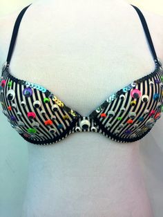 Jeepers Creepers, why so many peepers? This bra is the perfect answer to the lady who is a little tired of not being able to keep eyes on all creeps at once! Multi-colored wiggle eyes and sequins decorate this fun bra so you can have eyes all around you. The Betsey Johnson base bra has a lightly padded lining and converts to a cross back for extra styling options. This bra is available ready to ship as a 30B. Due to the intimate nature of this item returns are not accepted, please make sure you have confirmed sizing will be correct prior to purchasing. **Need a custom size? Interested in other colors not listed? Need them by a certain date? Please contact to discuss prior to ordering! Please note that due to individual screen settings actual color may appear slightly different than what is Fitted Rave Costume Accessories For Party, Trendy Party Bra, Trendy Fitted Party Bra, Bra Costume, Decorated Bras, Bra Crafts, Costume Bra, Rhinestone Bra, Bra Items